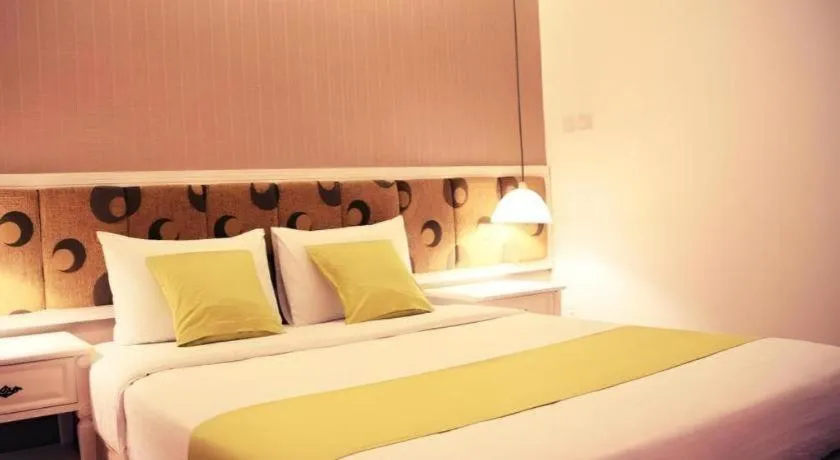 Bed in Golden Ant Hotels