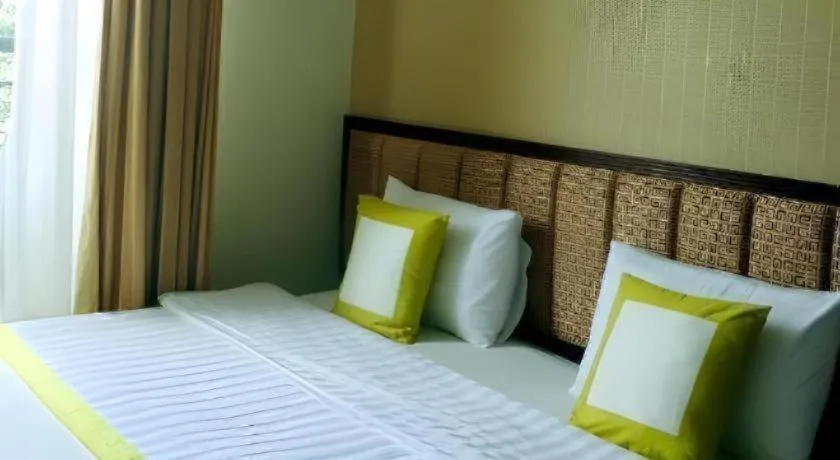 Bed in Golden Ant Hotels