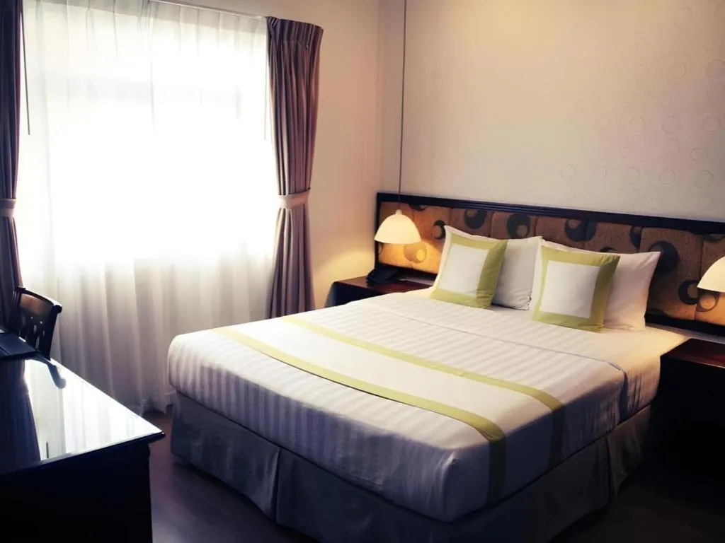 Bed in Golden Ant Hotels