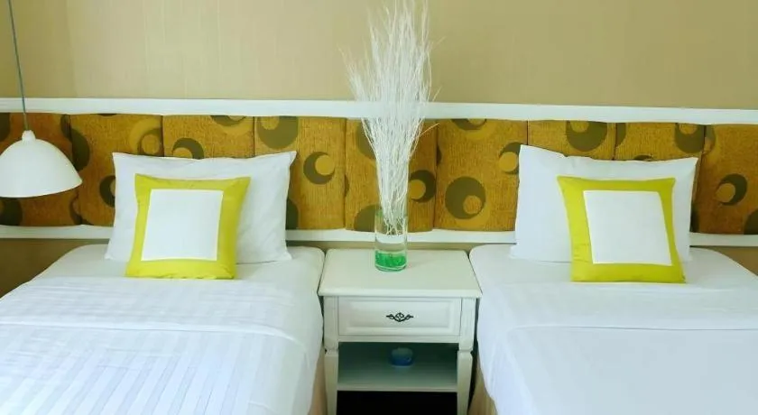 Bed in Golden Ant Hotels