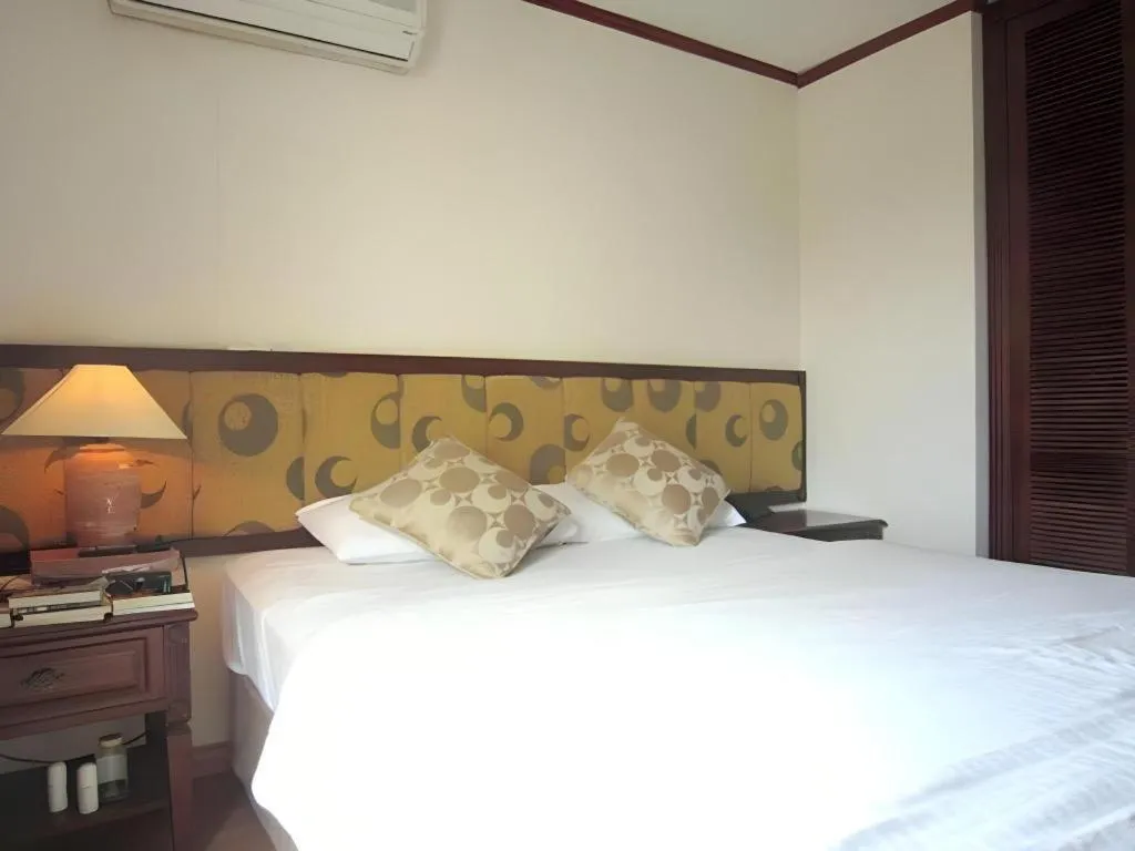 Bed in Golden Ant Hotels