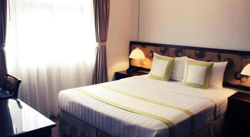 Bed in Golden Ant Hotels