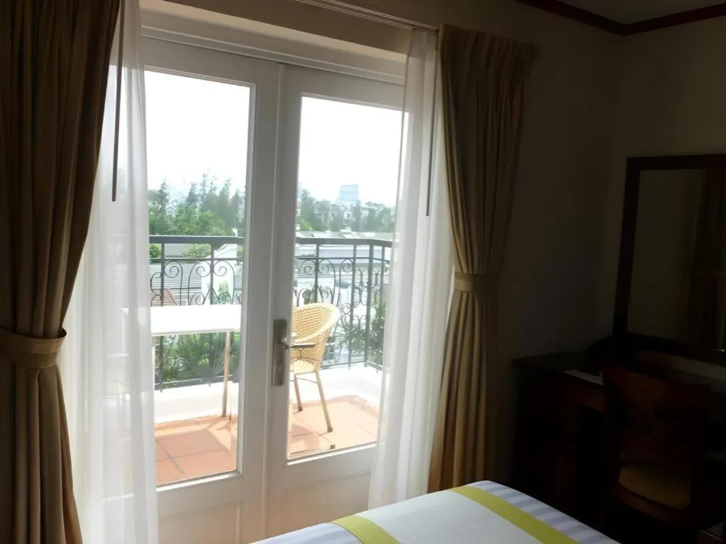 Bed in Golden Ant Hotels