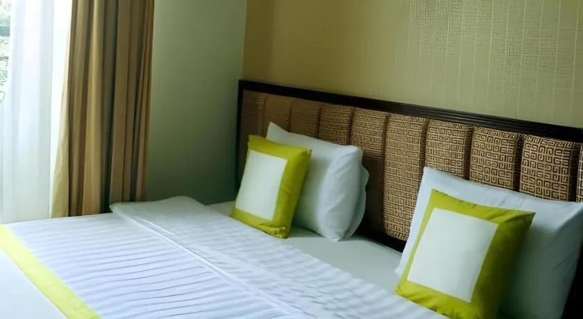 Bed in Golden Ant Hotels