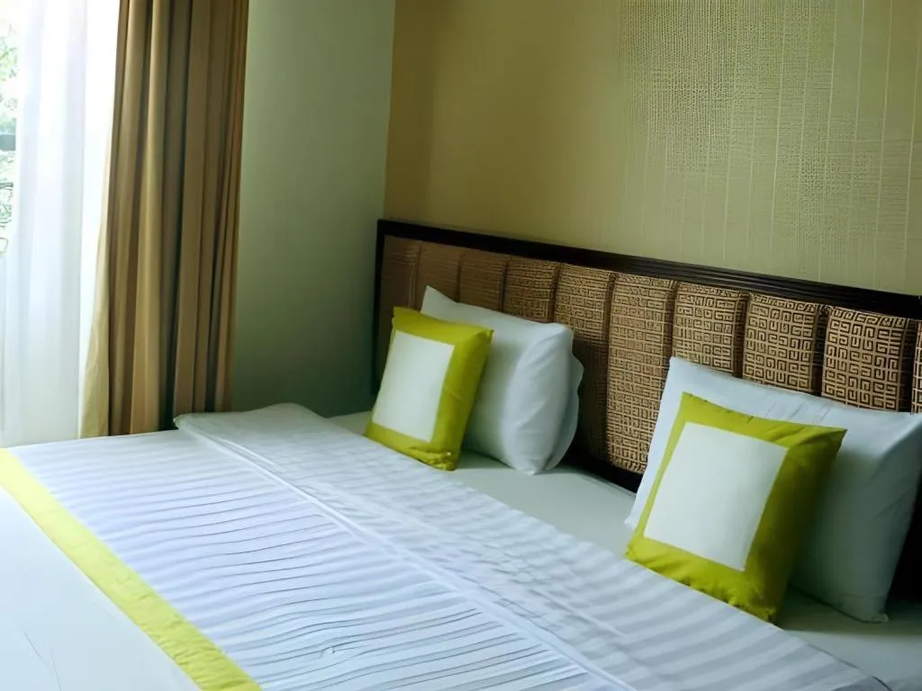 Bed in Golden Ant Hotels