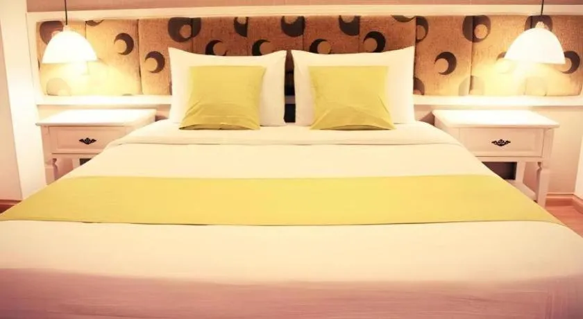 Bed in Golden Ant Hotels