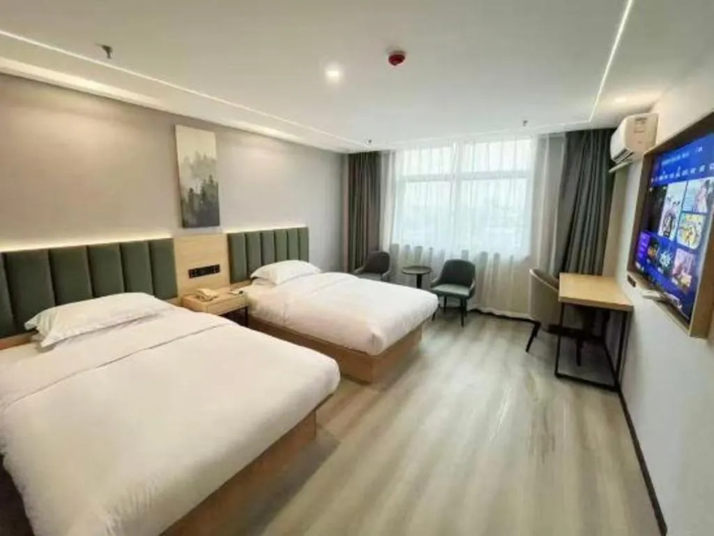 Bed in GreenTree Inn Taizhou Gaogang District Business Hotel