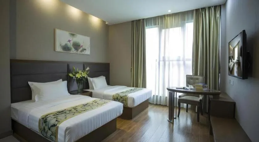 Bed in GreenTree Inn Taizhou Gaogang District Business Hotel