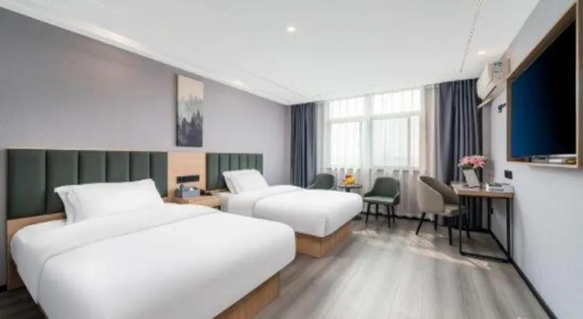 Bed in GreenTree Inn Taizhou Gaogang District Business Hotel
