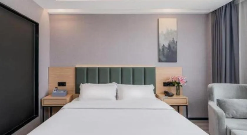 Bed in GreenTree Inn Taizhou Gaogang District Business Hotel