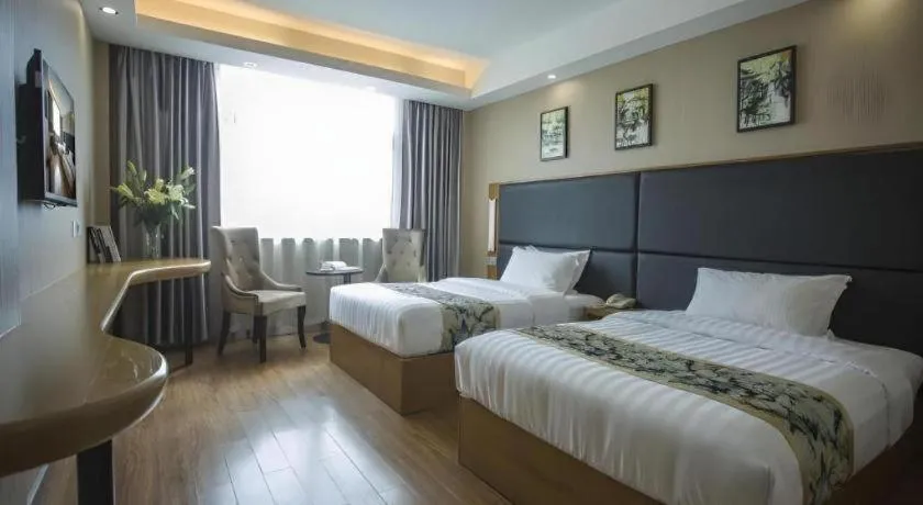 Bed in GreenTree Inn Taizhou Gaogang District Business Hotel