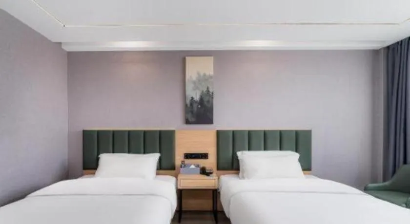 Bed in GreenTree Inn Taizhou Gaogang District Business Hotel