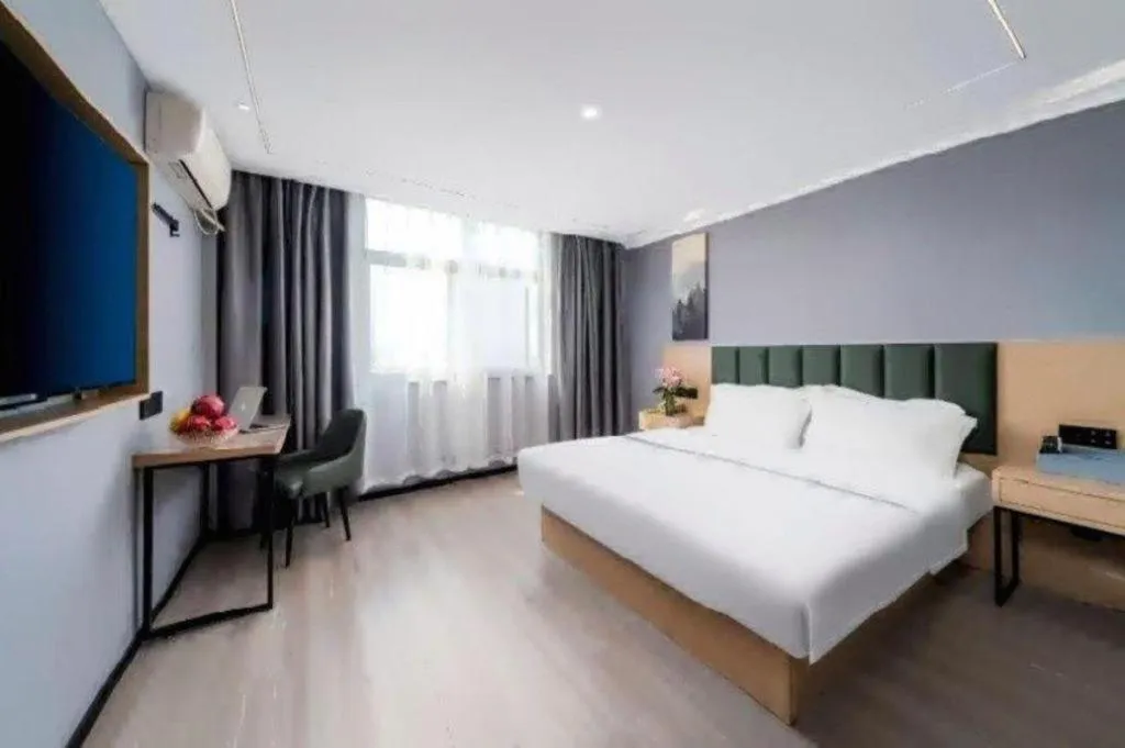 Bed in GreenTree Inn Taizhou Gaogang District Business Hotel