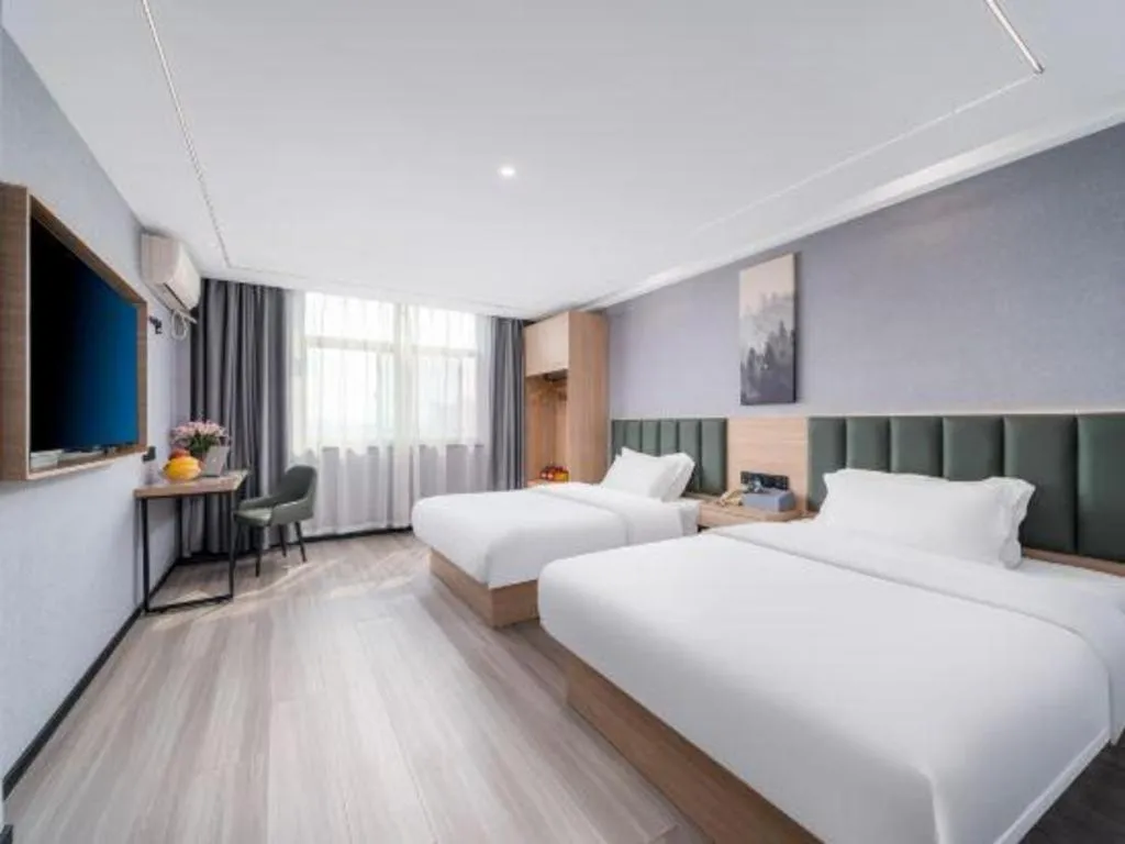Bed in GreenTree Inn Taizhou Gaogang District Business Hotel