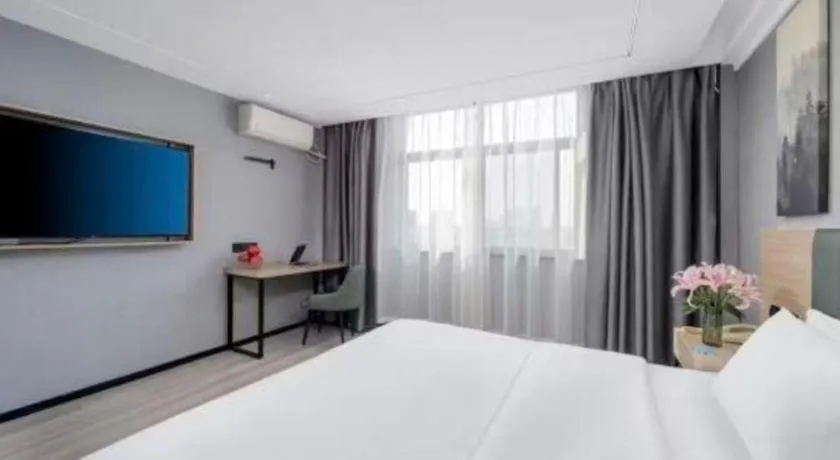 Bed in GreenTree Inn Taizhou Gaogang District Business Hotel