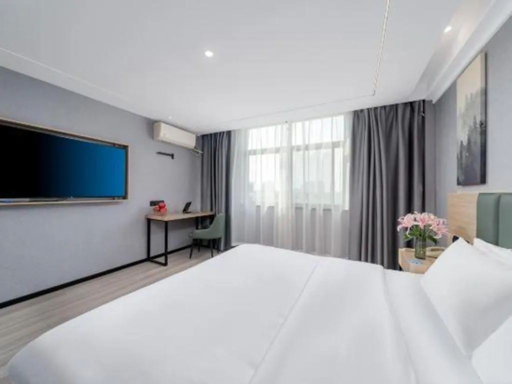 Bed in GreenTree Inn Taizhou Gaogang District Business Hotel