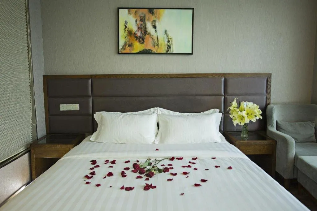 Bed in GreenTree Inn Taizhou Gaogang District Business Hotel