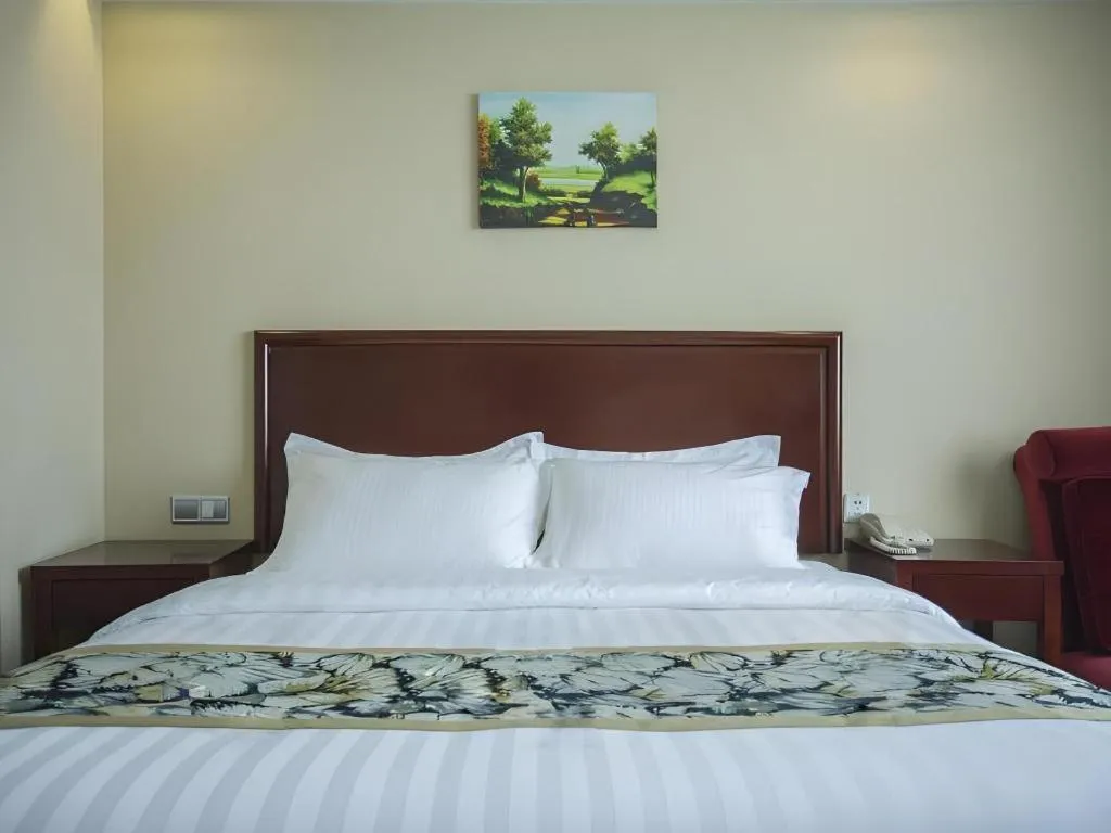 Bed in GreenTree Inn Taizhou Gaogang District Business Hotel