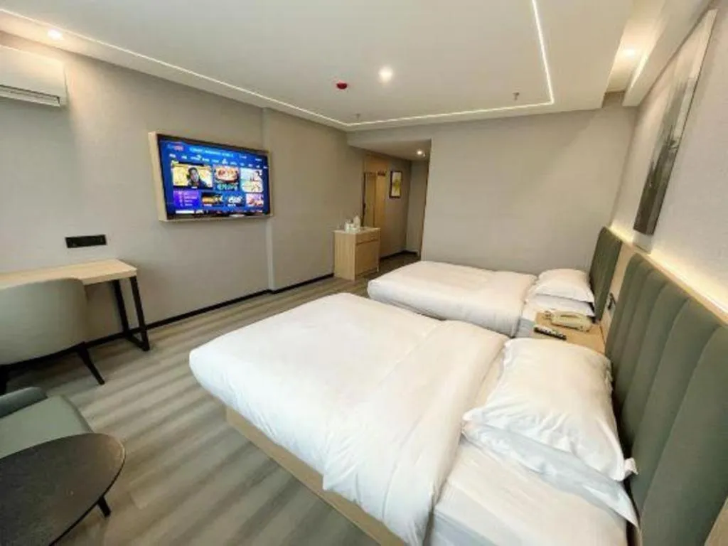 Bed in GreenTree Inn Taizhou Gaogang District Business Hotel