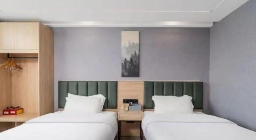 Bed in GreenTree Inn Taizhou Gaogang District Business Hotel