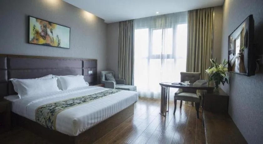 Bed in GreenTree Inn Taizhou Gaogang District Business Hotel
