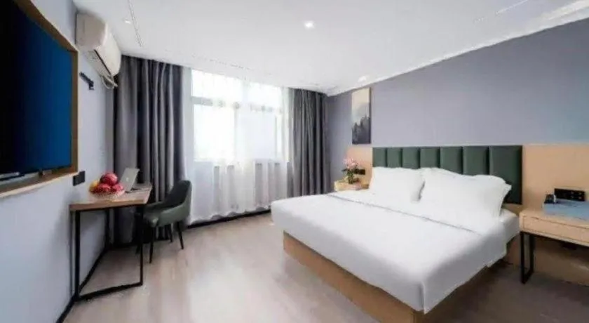 Bed in GreenTree Inn Taizhou Gaogang District Business Hotel