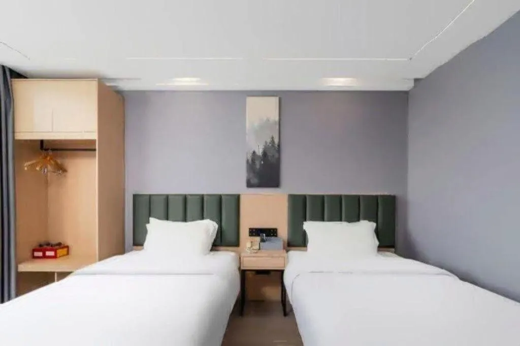 Bed in GreenTree Inn Taizhou Gaogang District Business Hotel