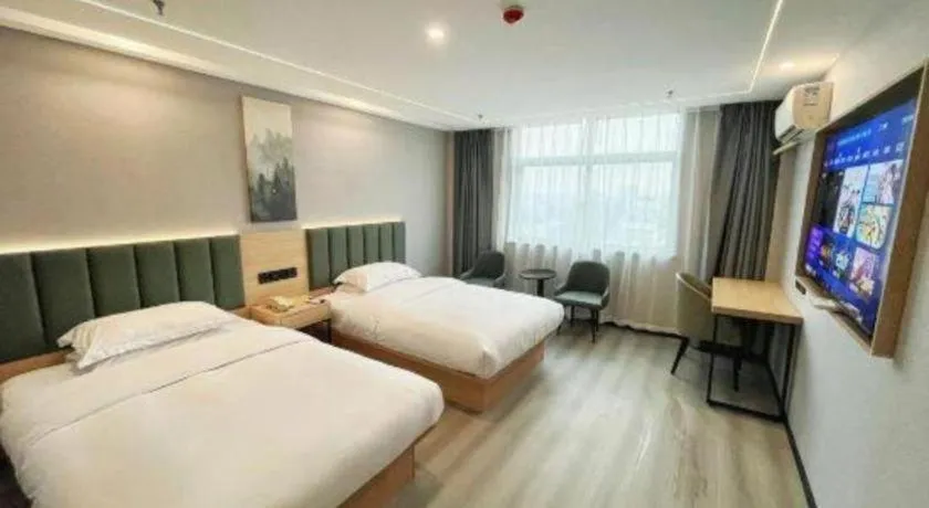 Bed in GreenTree Inn Taizhou Gaogang District Business Hotel