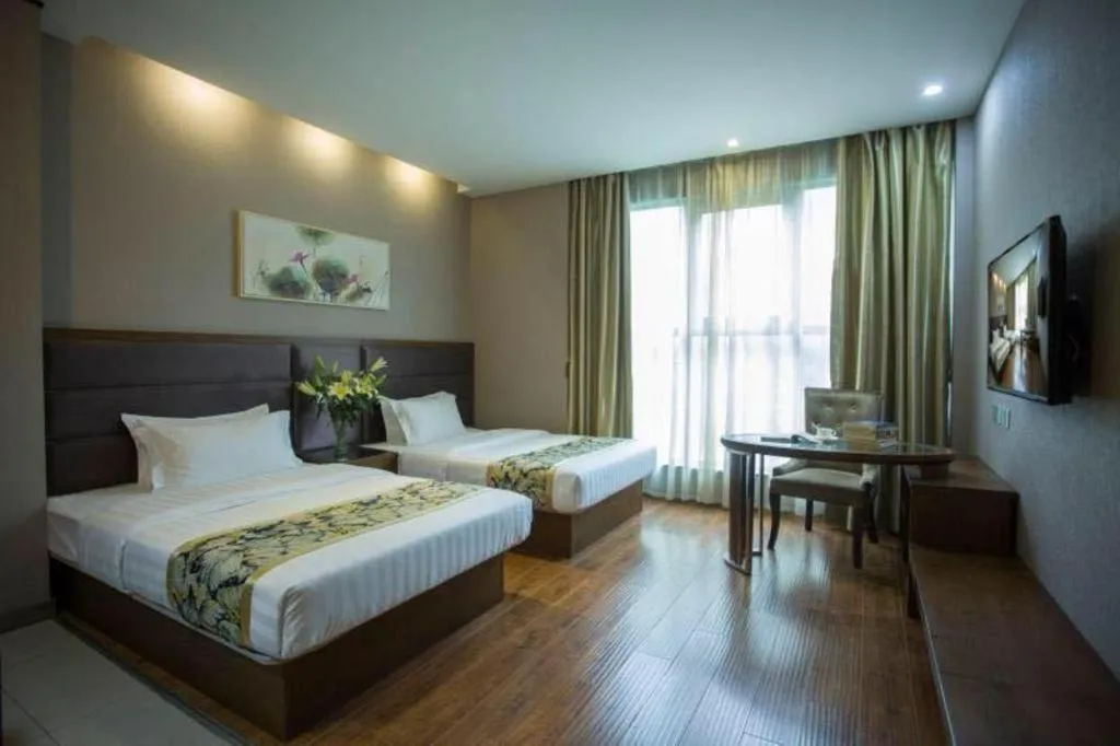 Bed in GreenTree Inn Taizhou Gaogang District Business Hotel