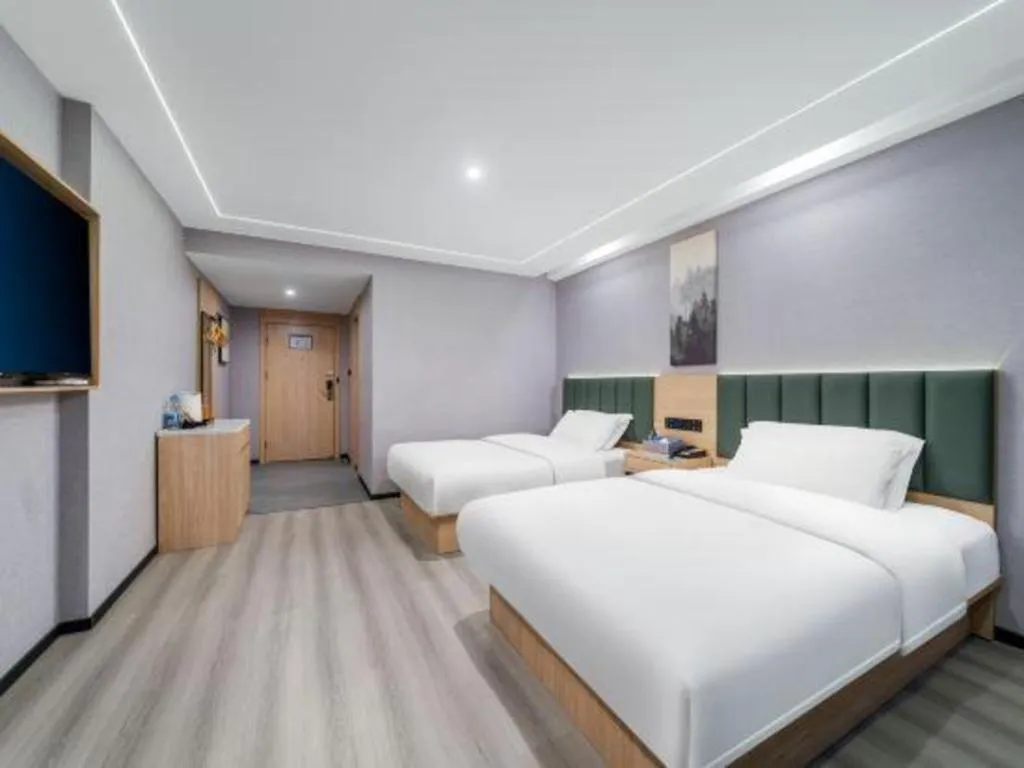 Bed in GreenTree Inn Taizhou Gaogang District Business Hotel