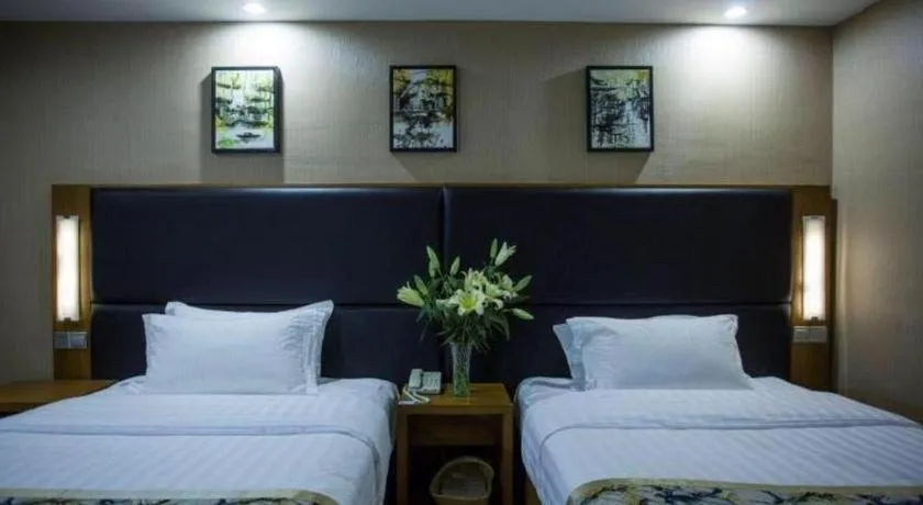 Bed in GreenTree Inn Taizhou Gaogang District Business Hotel