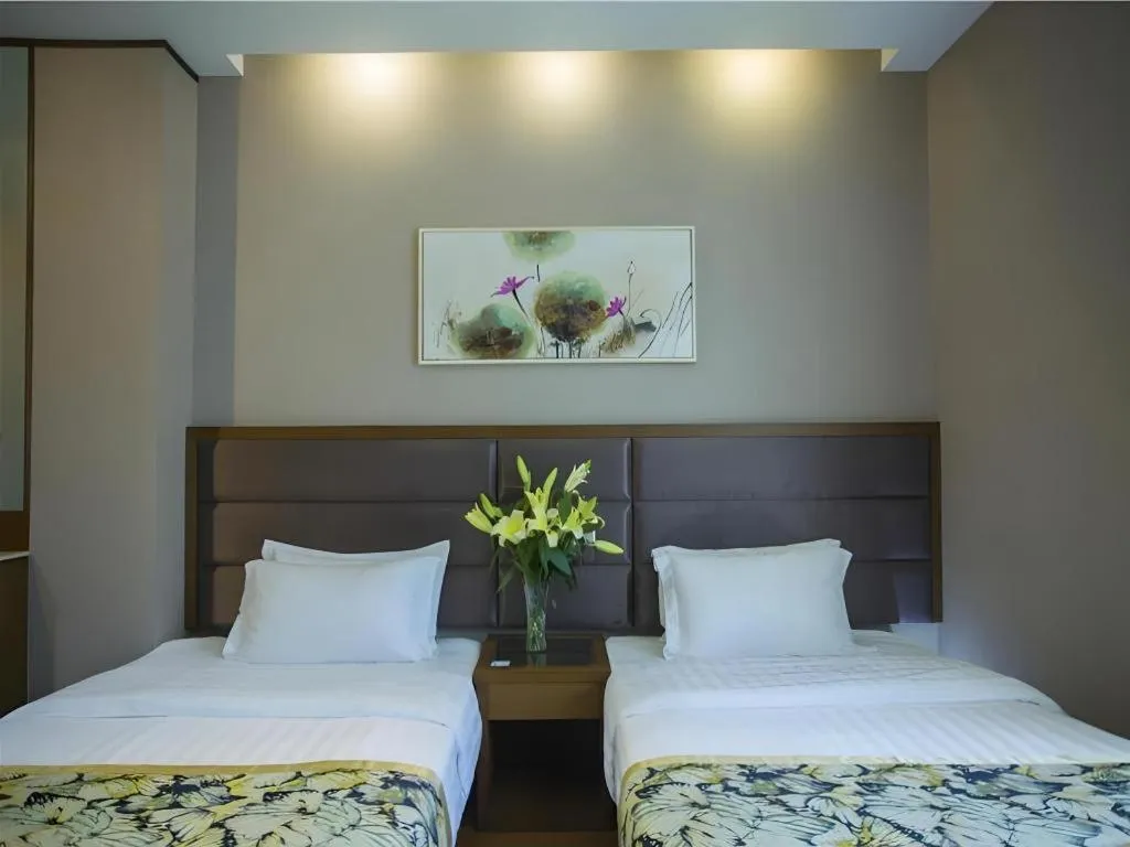 Bed in GreenTree Inn Taizhou Gaogang District Business Hotel