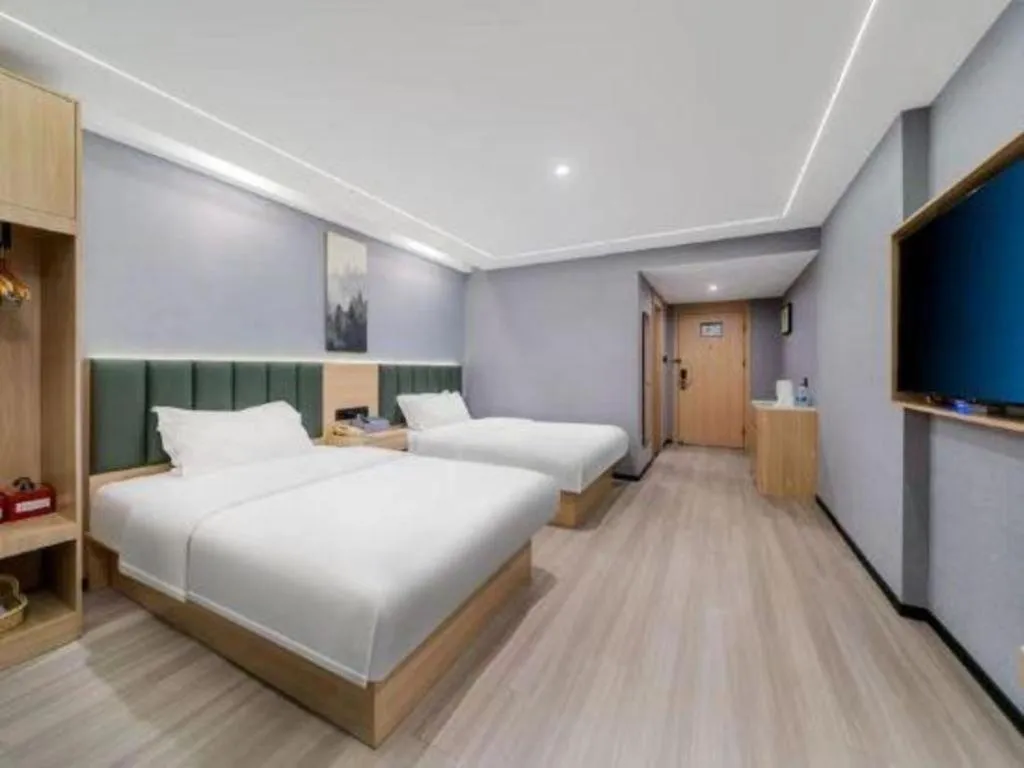 Bed in GreenTree Inn Taizhou Gaogang District Business Hotel