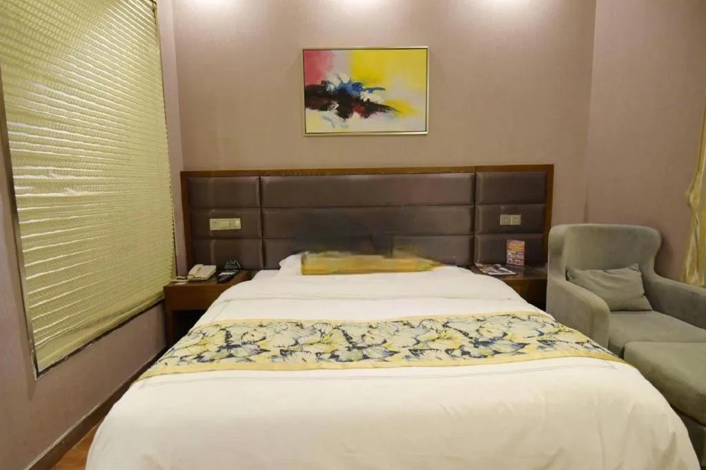 Bed in GreenTree Inn Taizhou Gaogang District Business Hotel