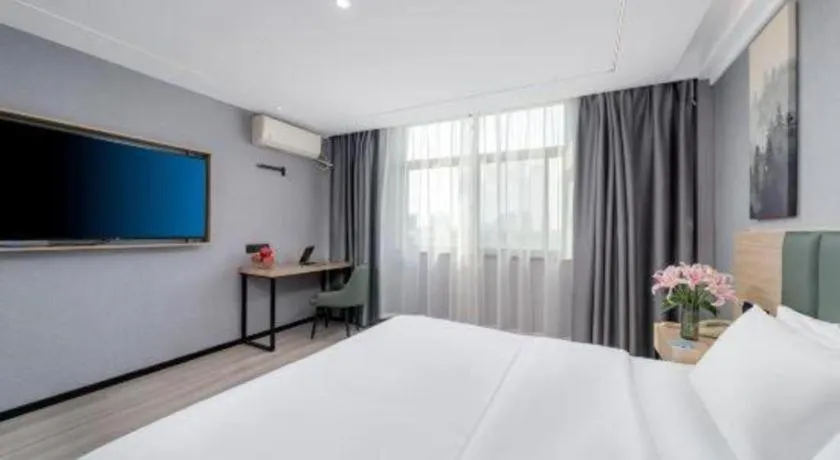 Bed in GreenTree Inn Taizhou Gaogang District Business Hotel