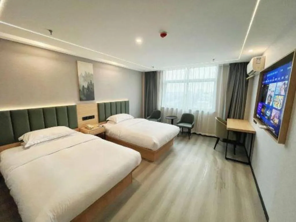 Bed in GreenTree Inn Taizhou Gaogang District Business Hotel