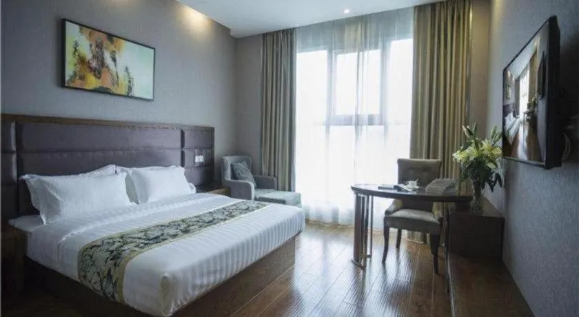 Bed in GreenTree Inn Taizhou Gaogang District Business Hotel