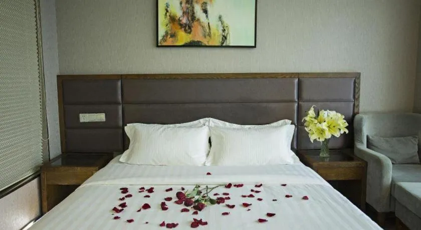 Bed in GreenTree Inn Taizhou Gaogang District Business Hotel
