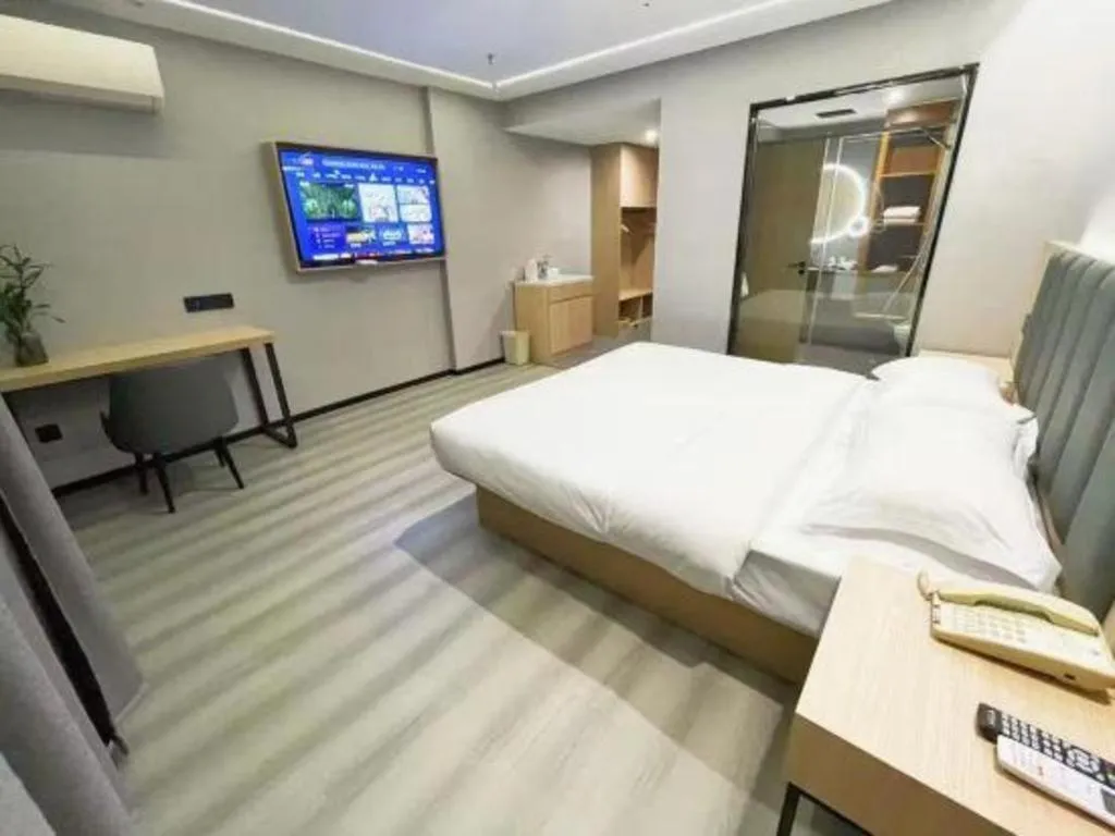Bed in GreenTree Inn Taizhou Gaogang District Business Hotel