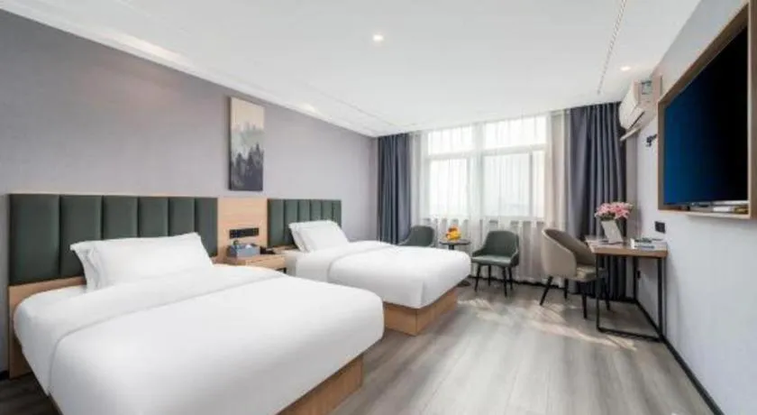 Bed in GreenTree Inn Taizhou Gaogang District Business Hotel