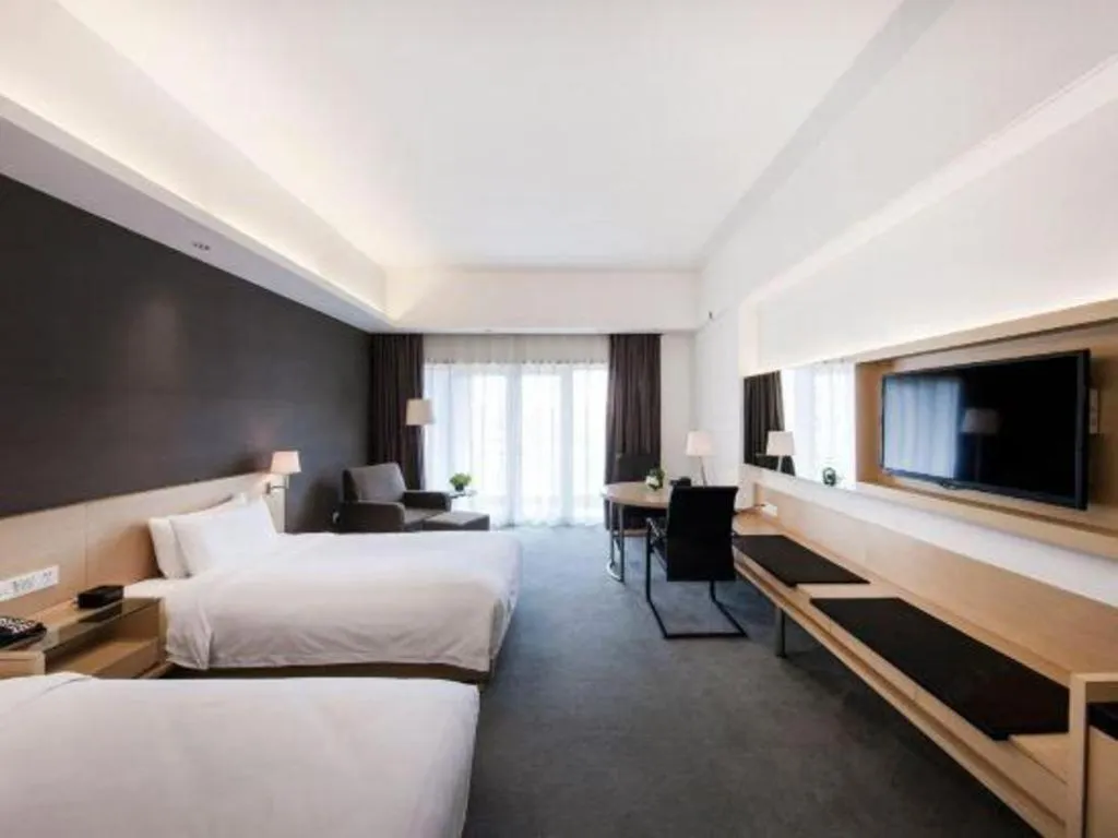 Bed in Hotel Maxmelim Beijing