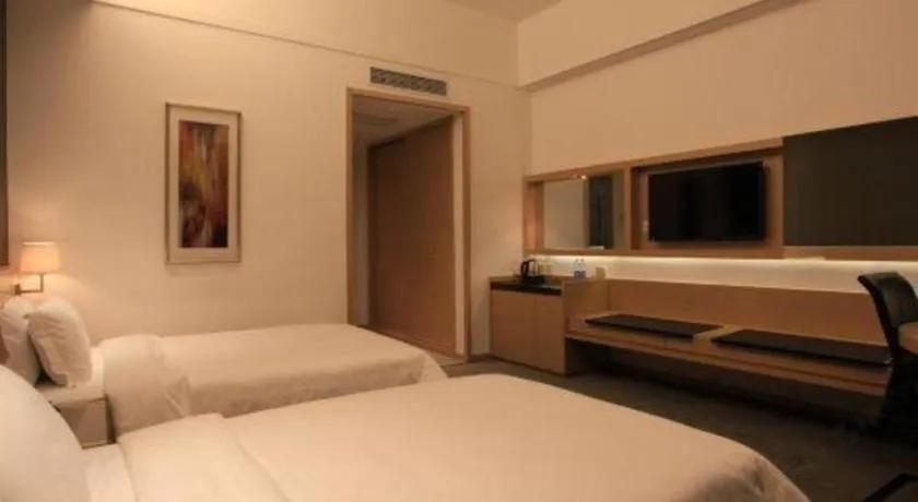 Bed in Hotel Maxmelim Beijing