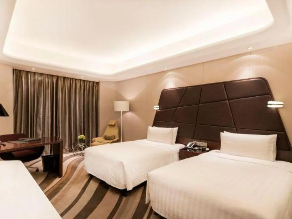 Bed in Hotel Maxmelim Beijing