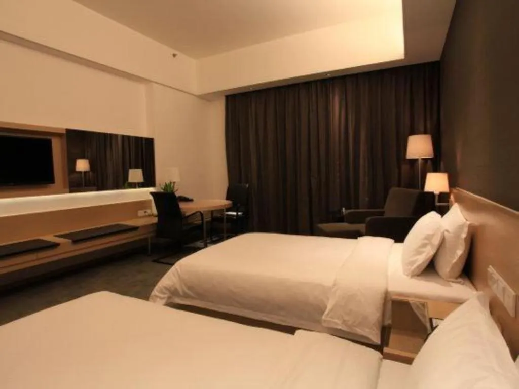 Bed in Hotel Maxmelim Beijing