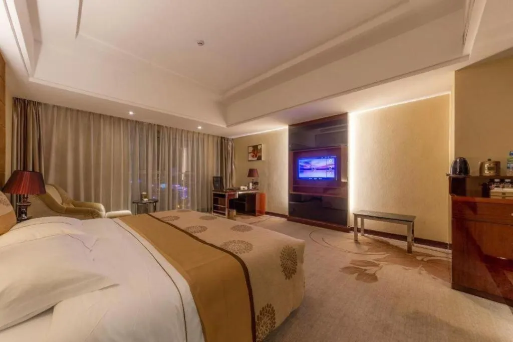 Bed in Xin Sheng Da Hong Sheng International Hotel