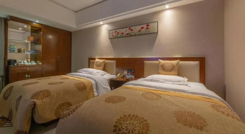 Bed in Xin Sheng Da Hong Sheng International Hotel