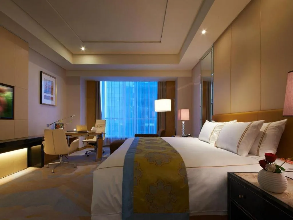 Bed in Grand Parkray Hangzhou Hotel