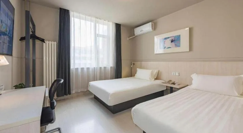 Bed in Jinjiang Inn Beijing Huairou Qingchun Road Wanda Plaza
