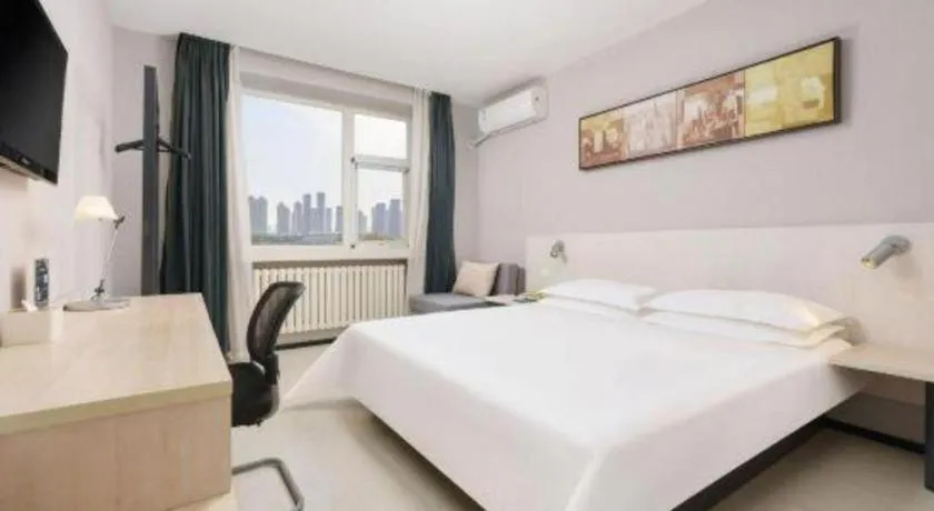 Bed in Jinjiang Inn Dalian Development Zone Jinma Road Light Railway Station