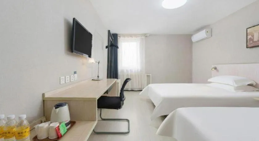 Bed in Jinjiang Inn Dalian Development Zone Jinma Road Light Railway Station